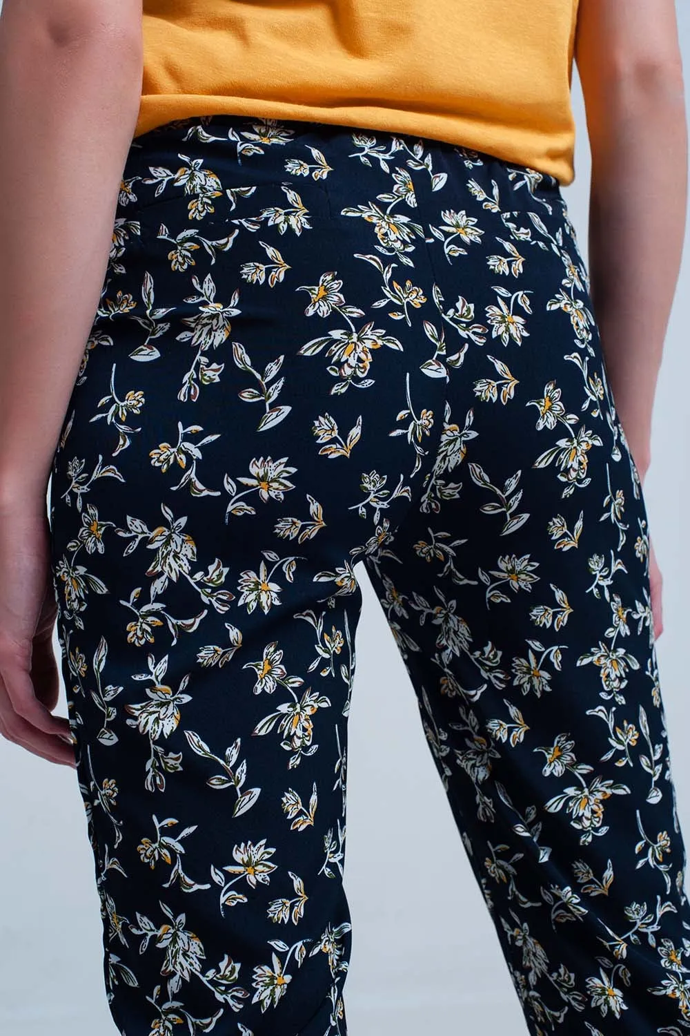 Navy floral pants with a belt