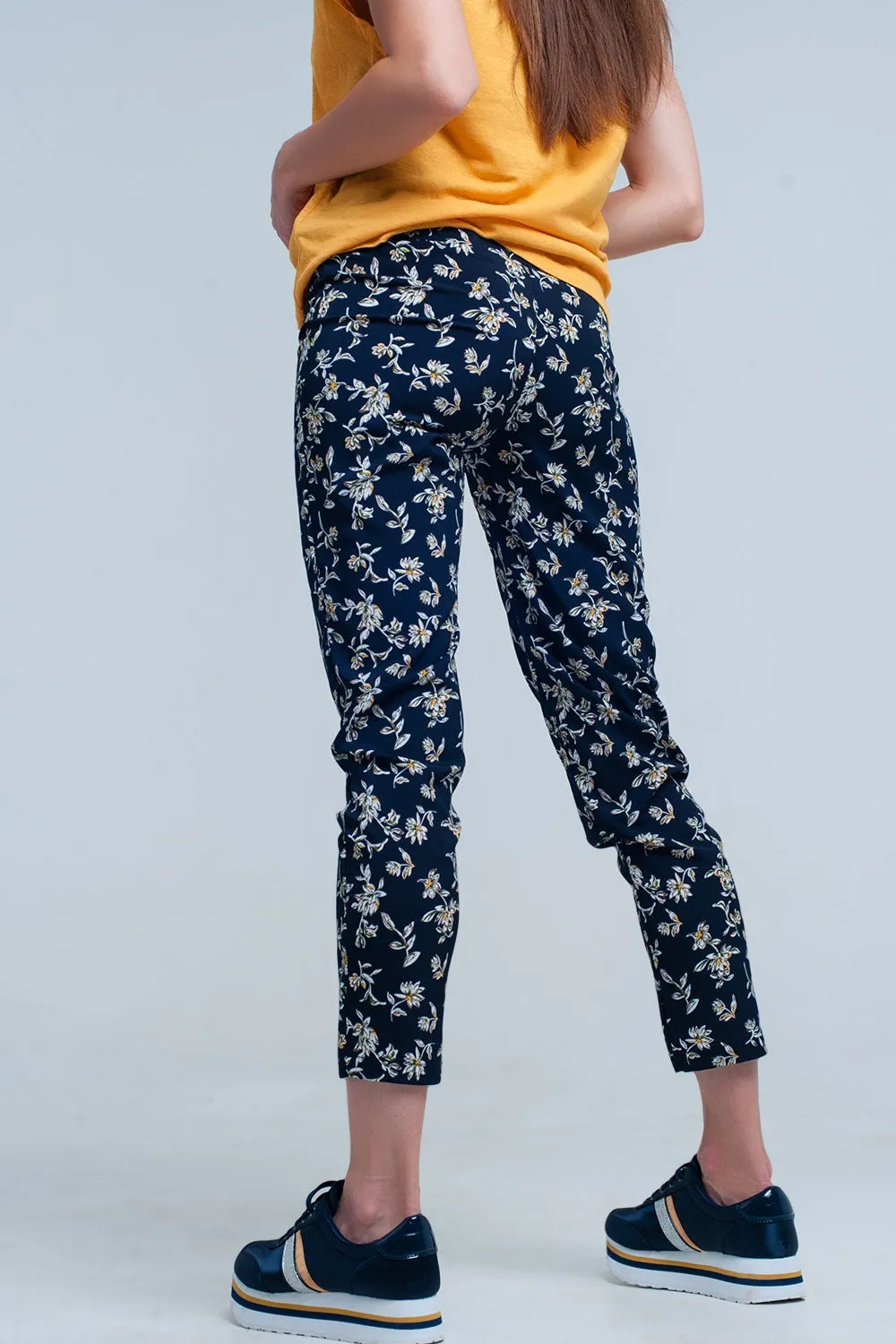 Navy floral pants with a belt