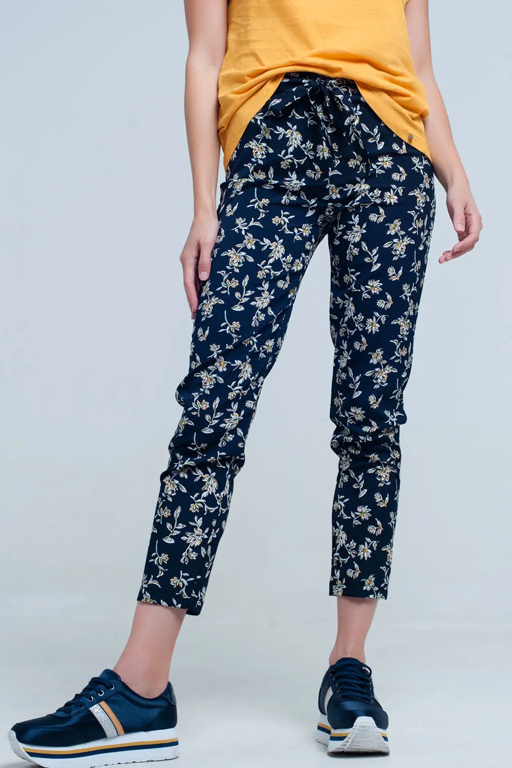 Navy floral pants with a belt