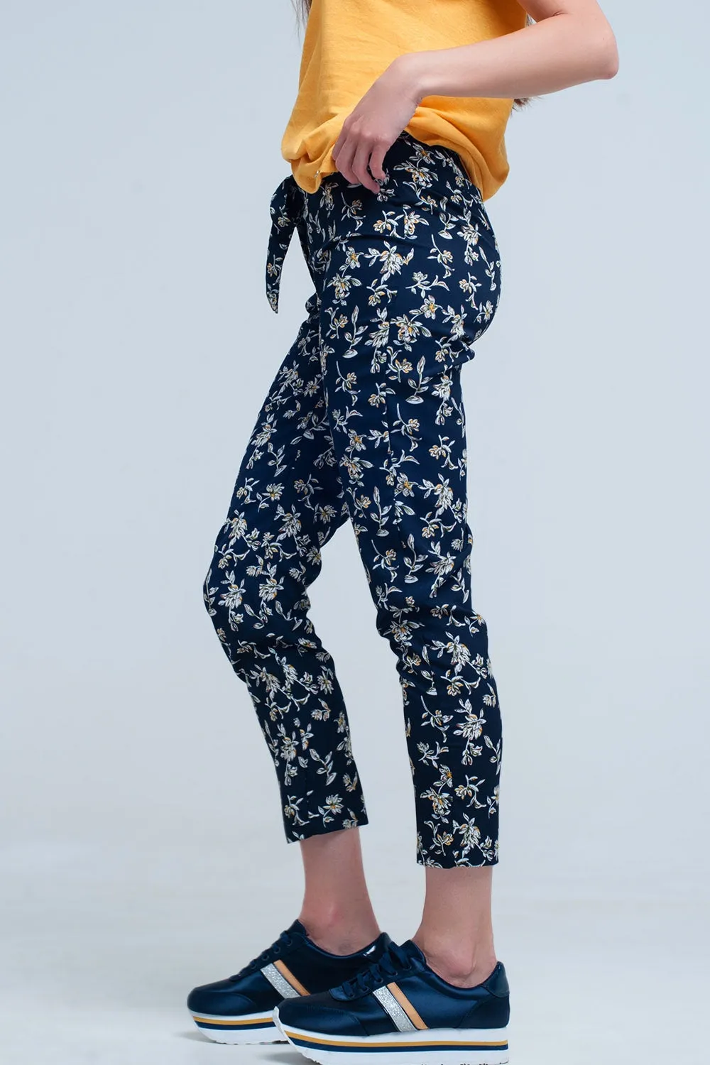 Navy floral pants with a belt